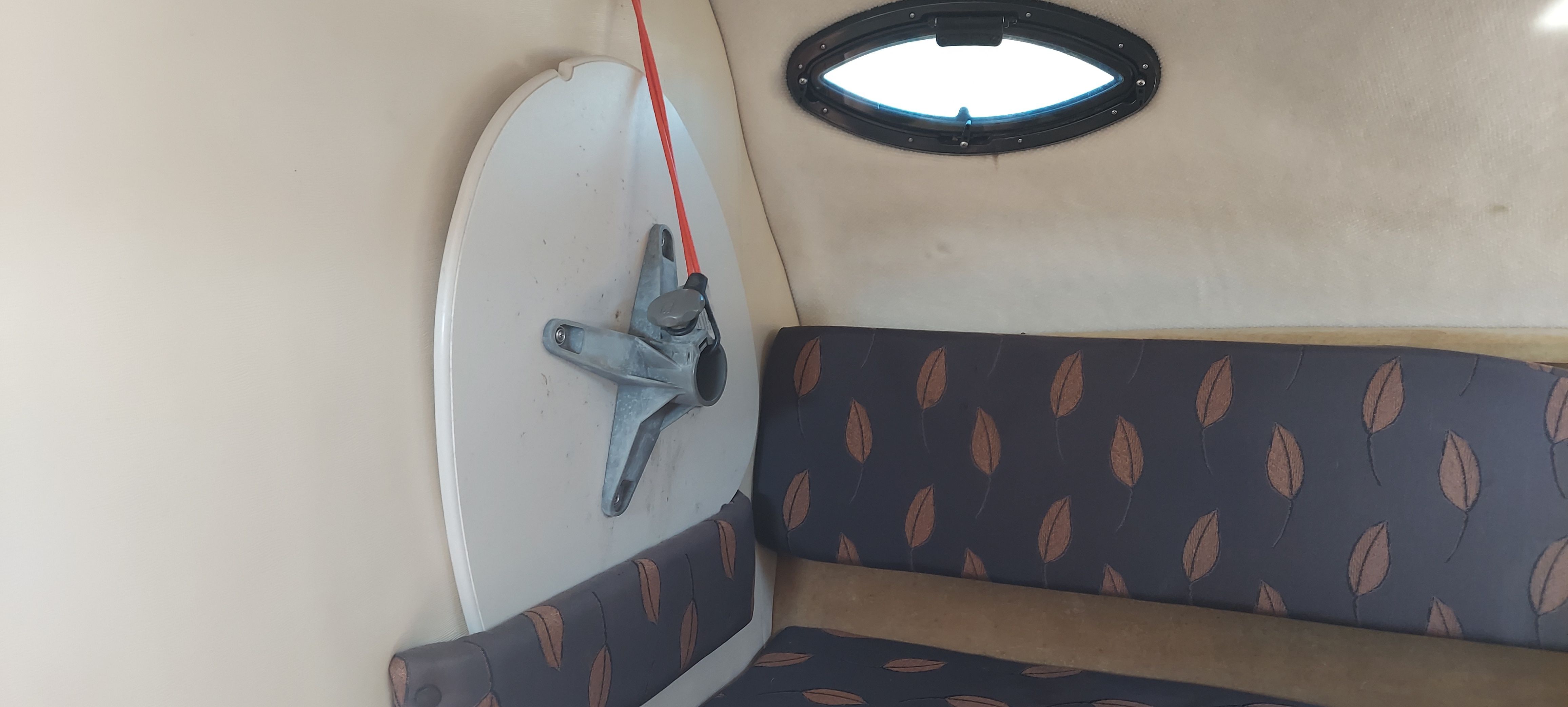 Interior of 2004 Regal Commodore 2465 boat with seating area.