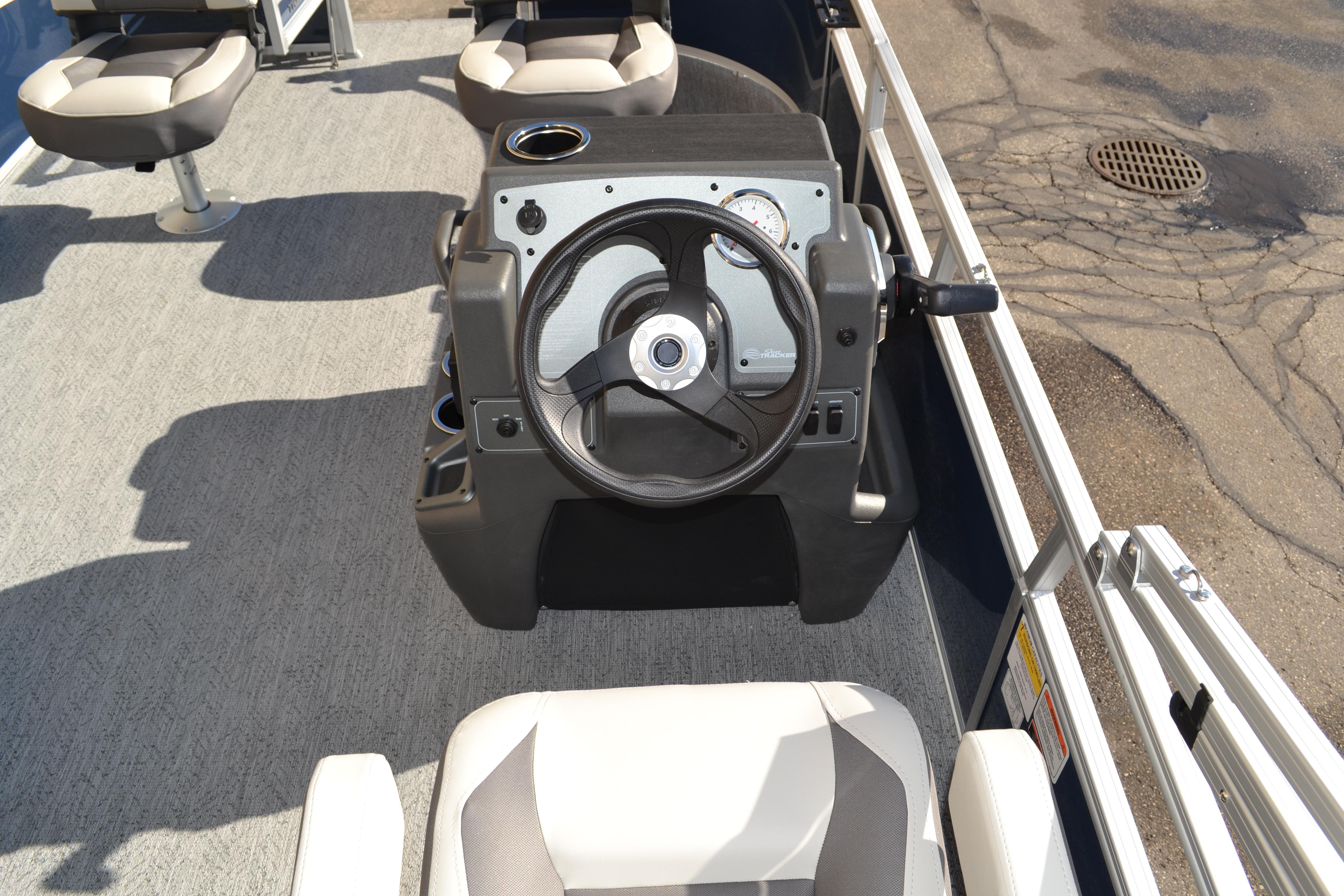 2026 Sun Tracker Bass Buggy 16 XL Select boat interior with steering console and seating.