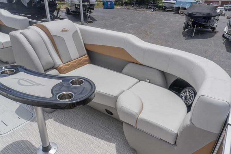 2026 SunCatcher Elite 326 SS boat interior with plush seating and cup holders.
