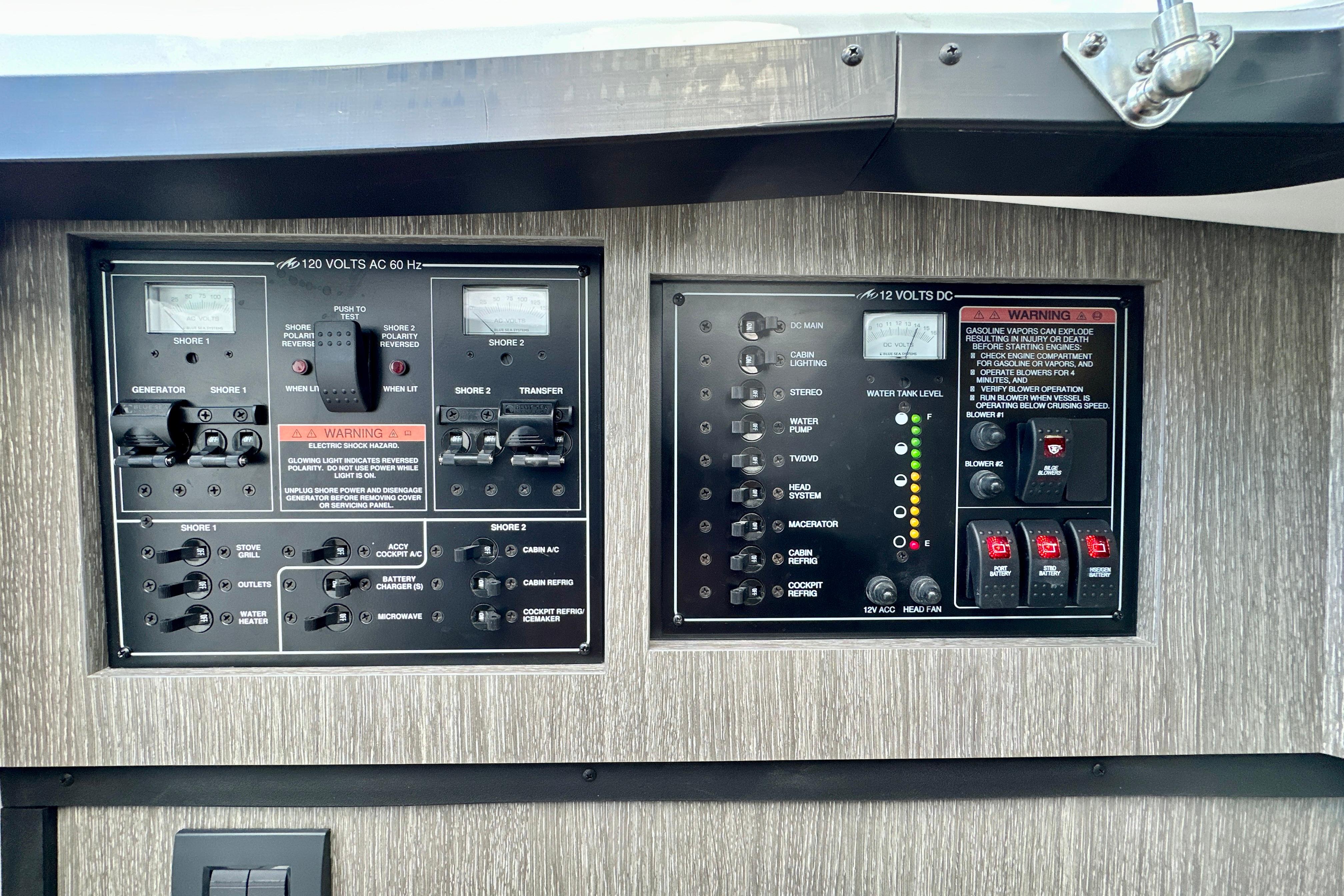 Electrical control panel of a 2022 Monterey 378SS Super Sport boat, featuring AC and DC systems.