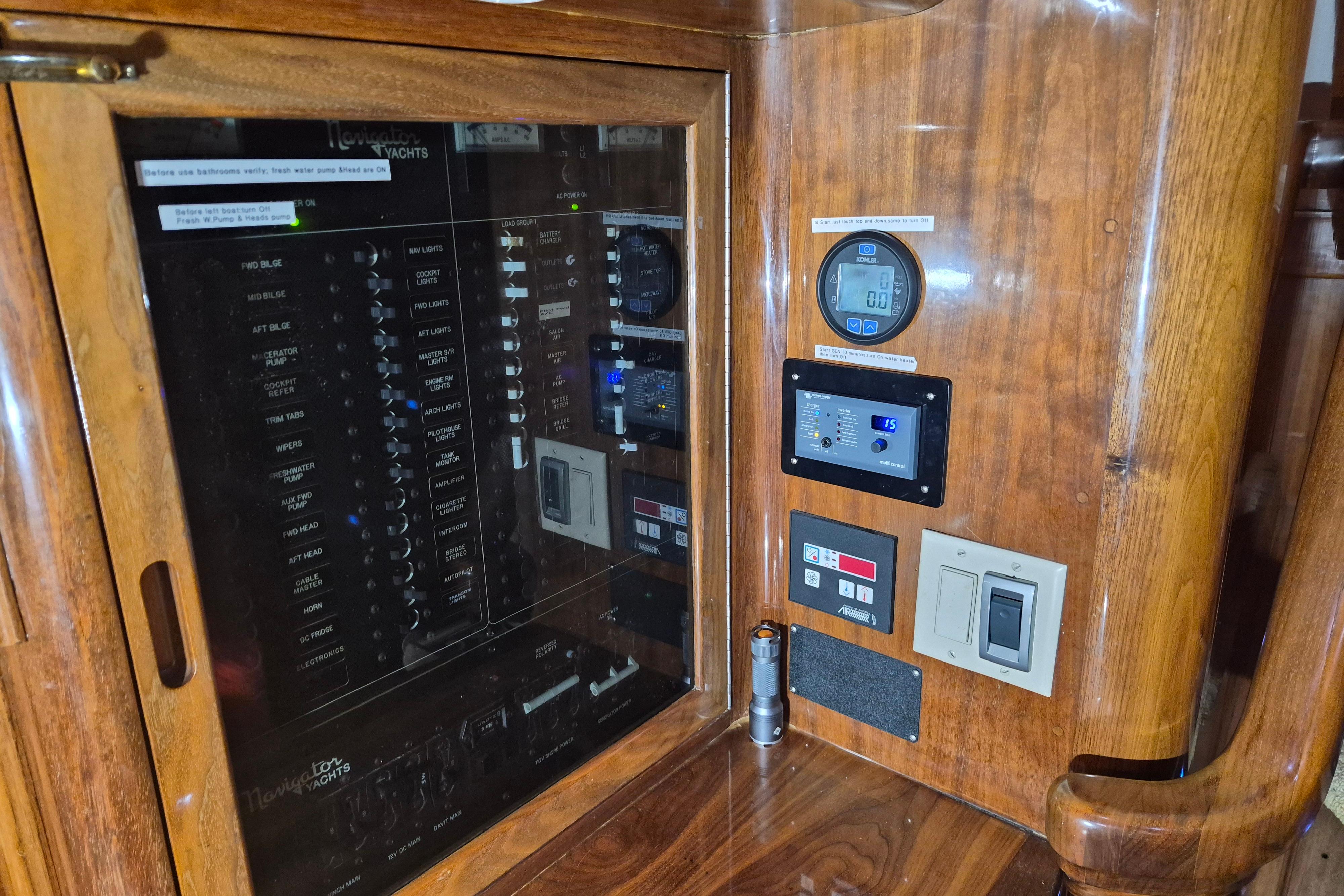 Control panel of a 2003 Navigator Californian Veneti yacht with wooden finish.