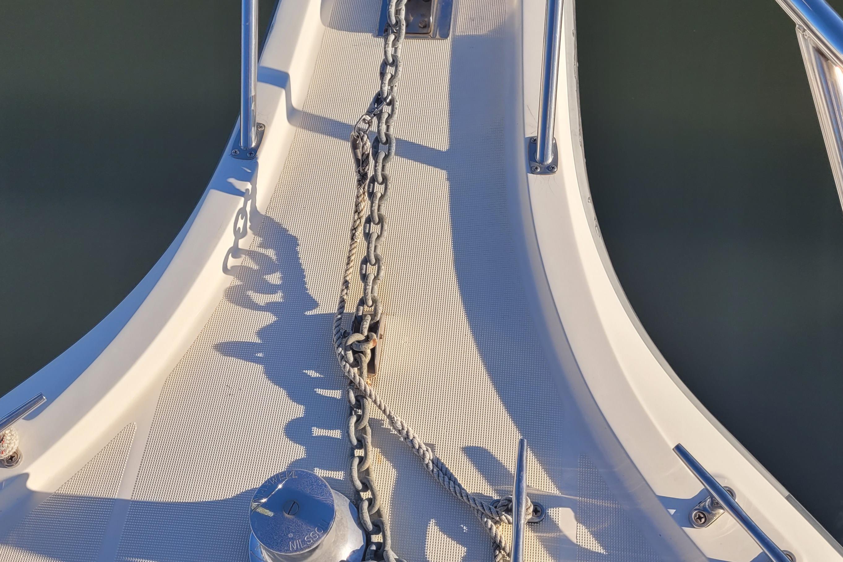 Bow of 1988 Tiara Yachts 3600 Convertible with anchor chain and rope.