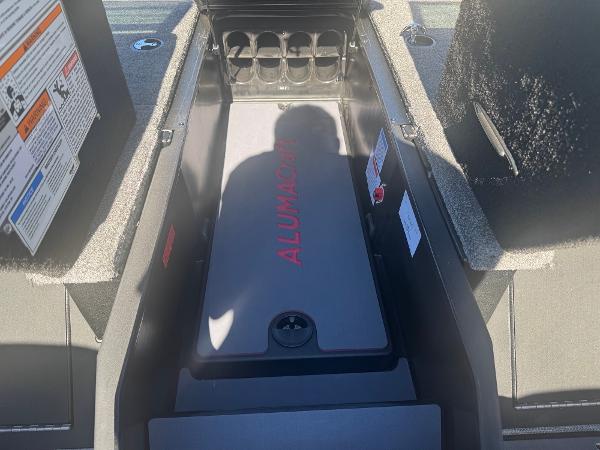 2025 Alumacraft Trophy 185X SC Rotax S boat storage compartment with safety instructions.