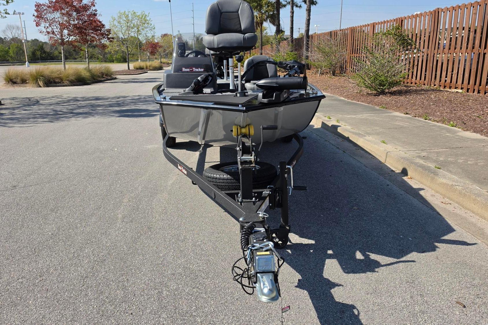 2026 Tracker Bass Tracker Classic XL boat on trailer in parking lot.