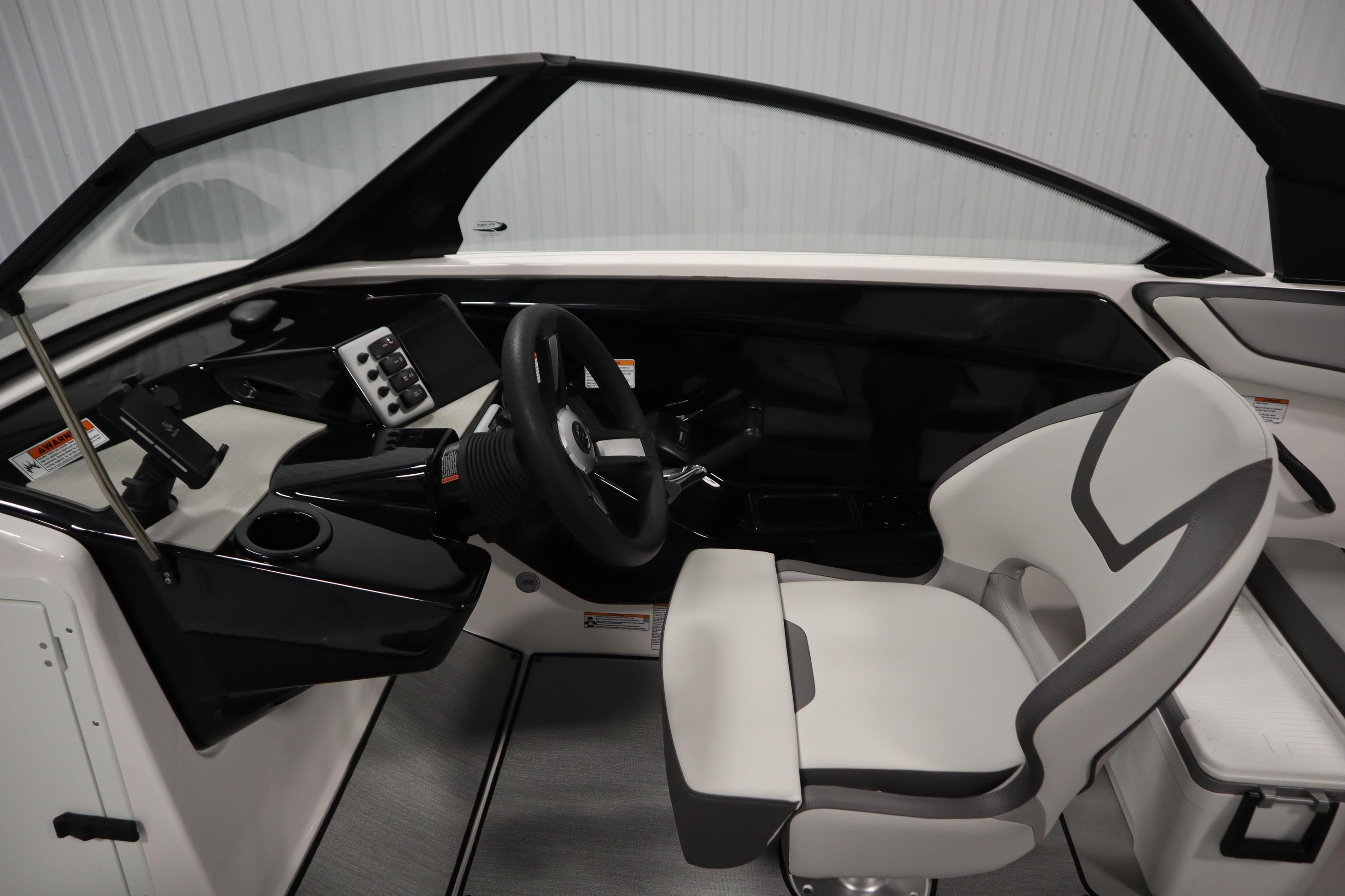 2026 Yamaha Boats AR220 cockpit with modern steering and seating design.