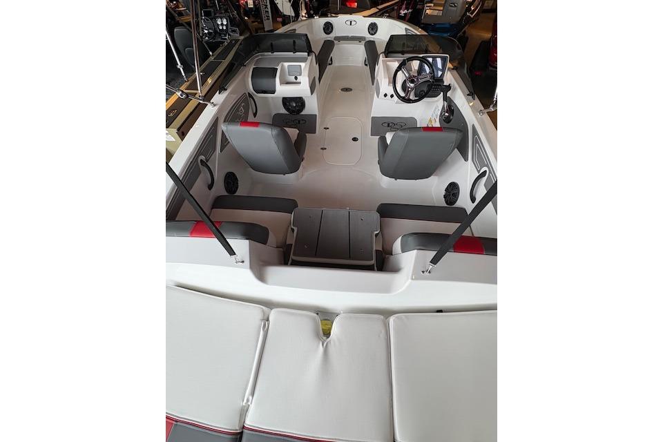 2026 Tahoe T21 boat interior with seating and steering wheel, showcasing modern design.