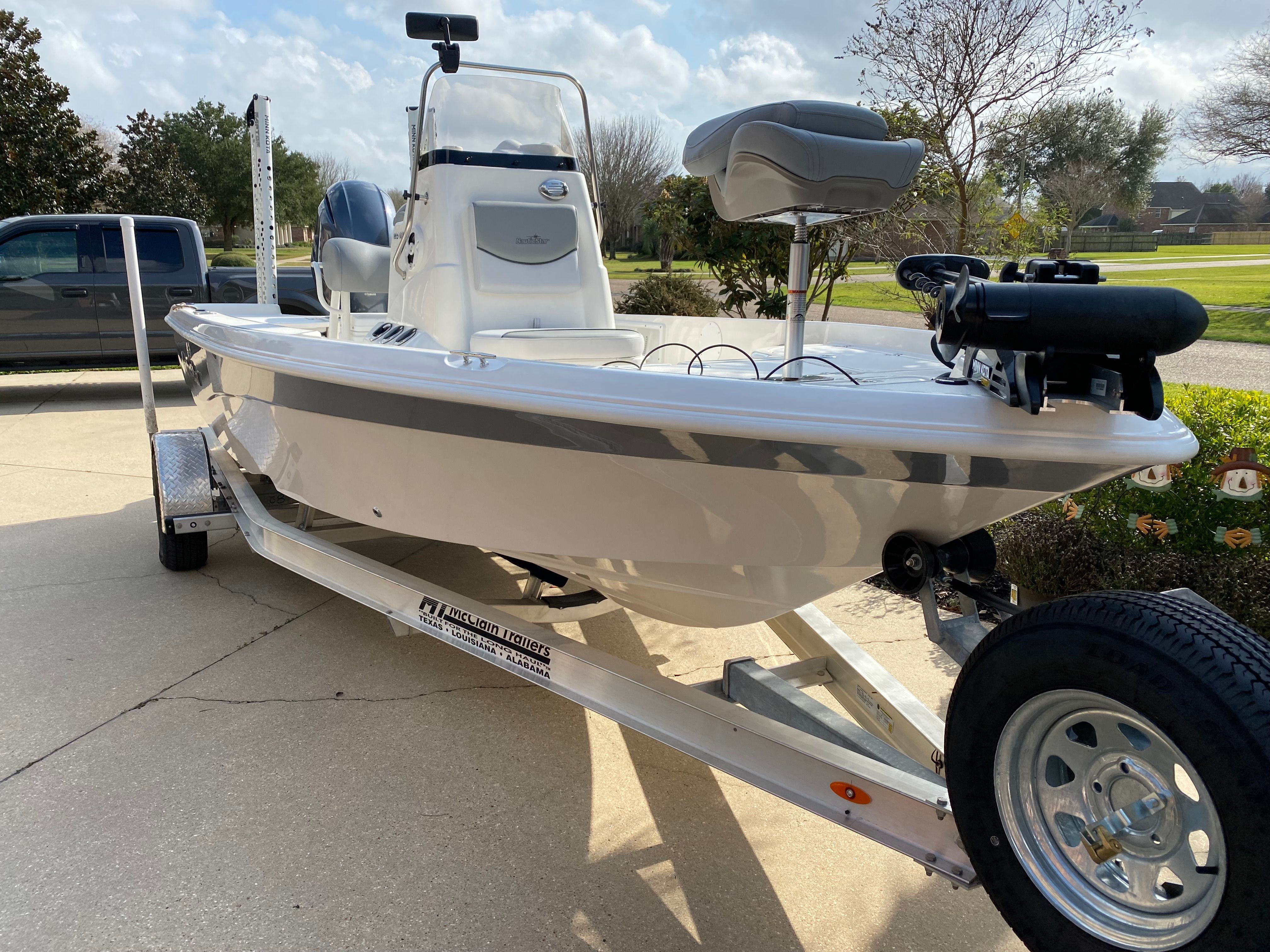 A 2021 NauticStar 195 XTS on a trailer, ready for the water.