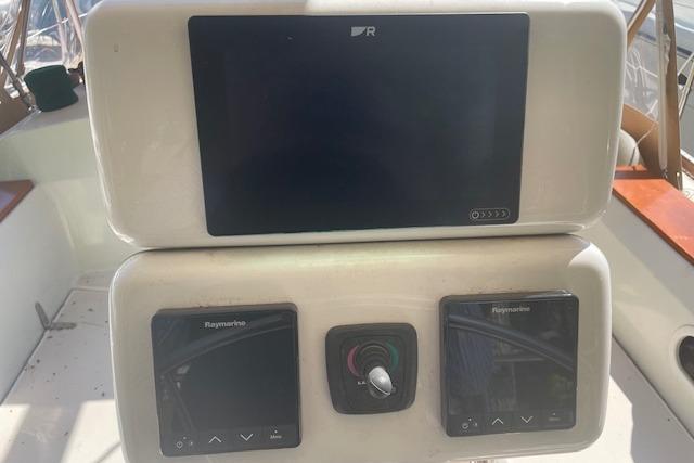 Control panel of a 1993 Sabre 38 sailboat with Raymarine displays.