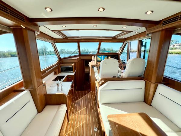 Luxurious interior of 2025 Sabre 43 Salon Express yacht with elegant wood finish.