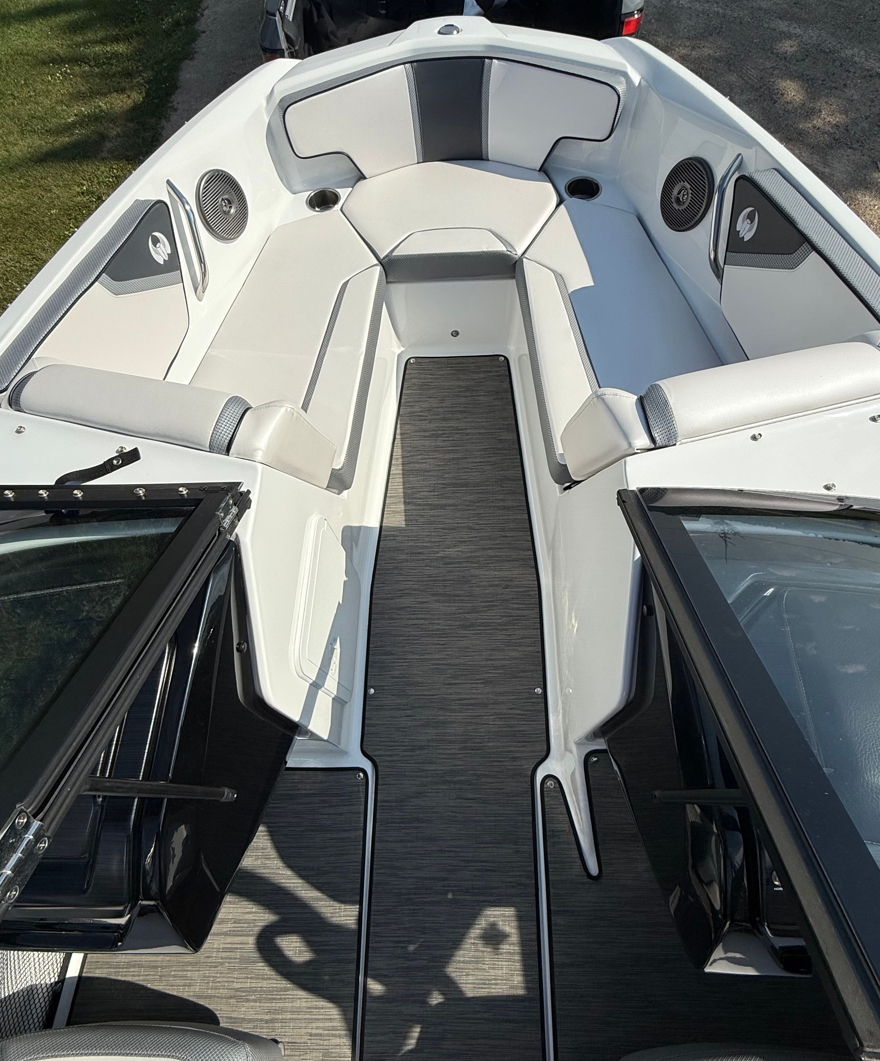 The image shows the interior of a 2023 Scarab 195 ID boat with modern seating and speakers.