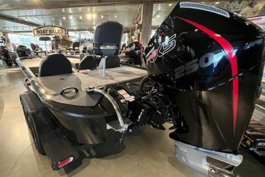 2025 Tracker Savage 215 boat with powerful 250 HP engine displayed in showroom.