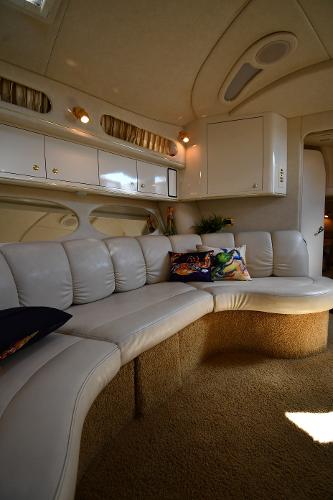 Luxurious interior of a 1997 Sea Ray 400 Sundancer yacht with plush seating.