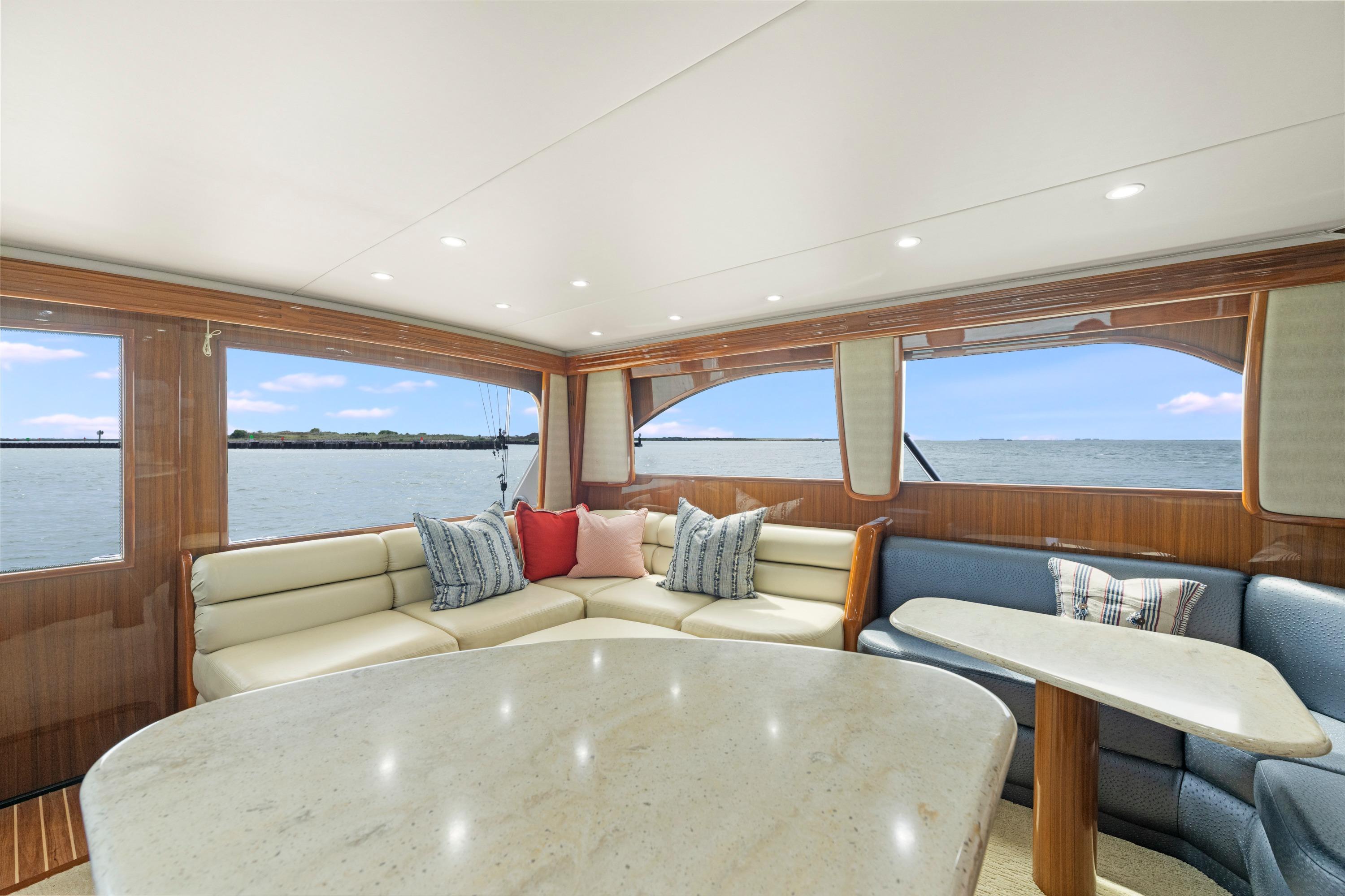 Luxurious interior of 2009 Viking 50 Convertible yacht with ocean view.