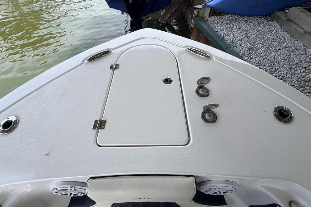 Bow of 2024 Tidewater 232 LXF boat with storage hatch and cleats.