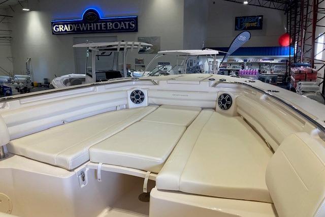 2026 Grady-White Canyon 336 boat interior with cushioned seating in showroom.
