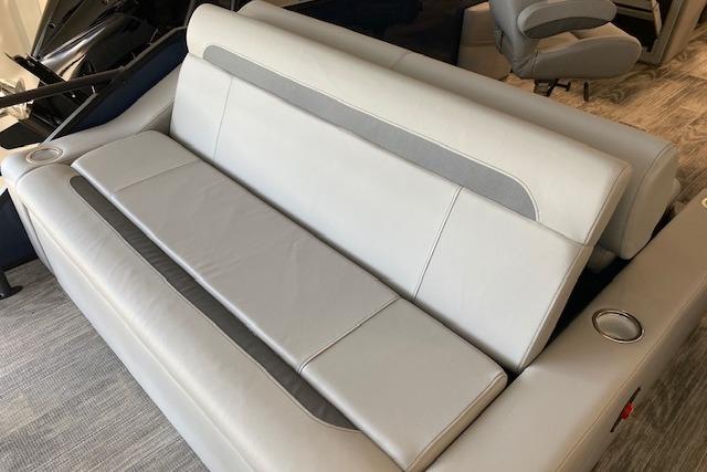 2026 Bentley Pontoons Legacy 243 Swingback interior seating, featuring luxurious gray upholstery and cup holders.