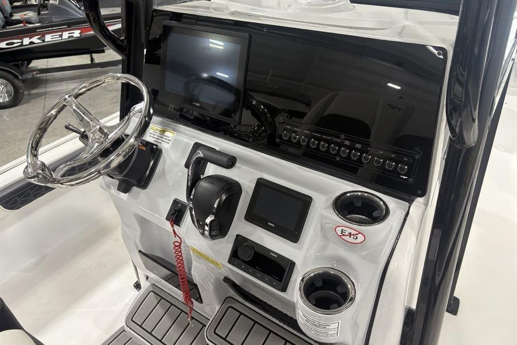 2026 Tidewater 2300 Carolina Bay boat console with steering wheel and electronic controls.