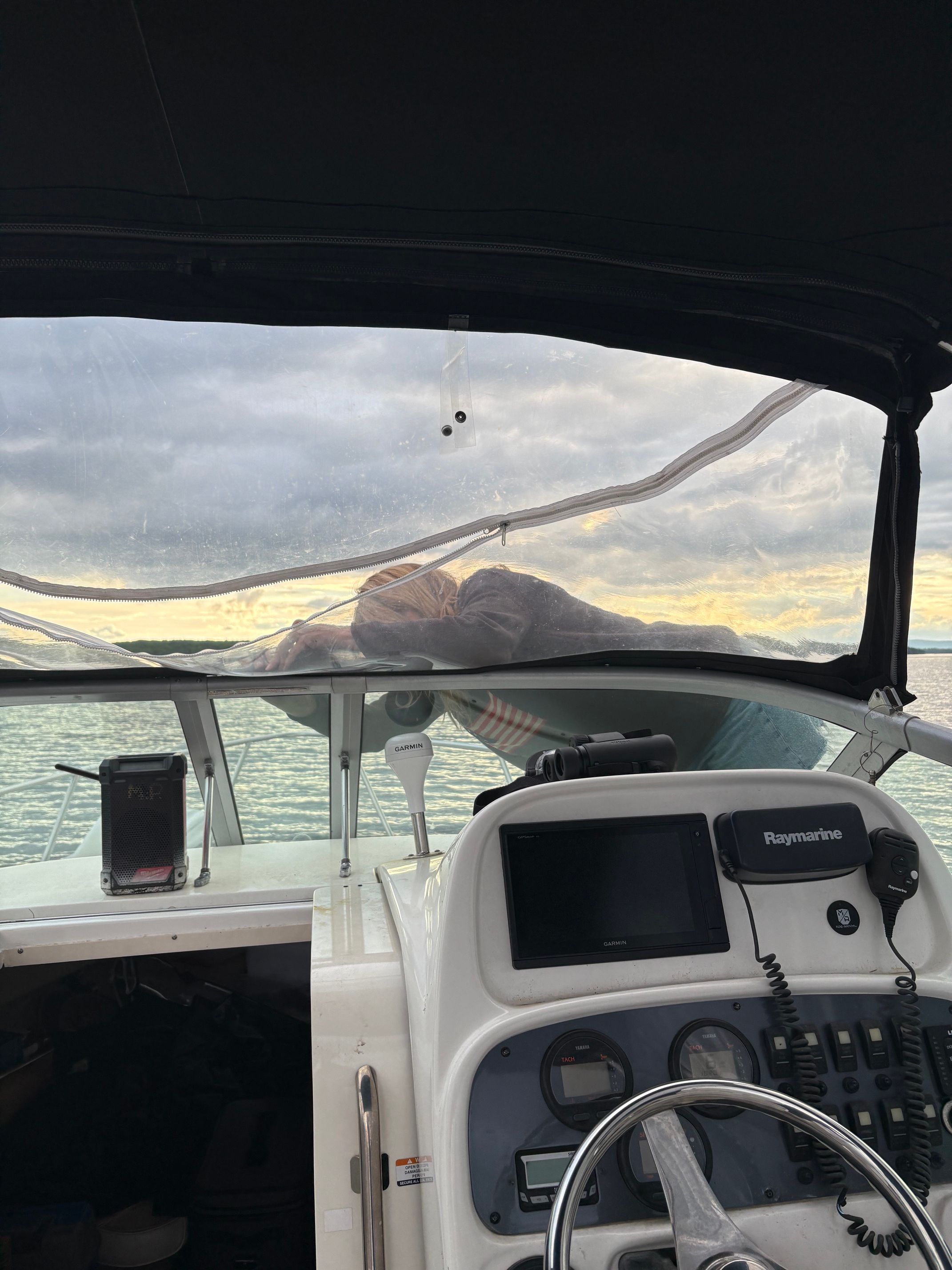 View from the cockpit of a Robalo R265 Walkaround looking out onto the water.