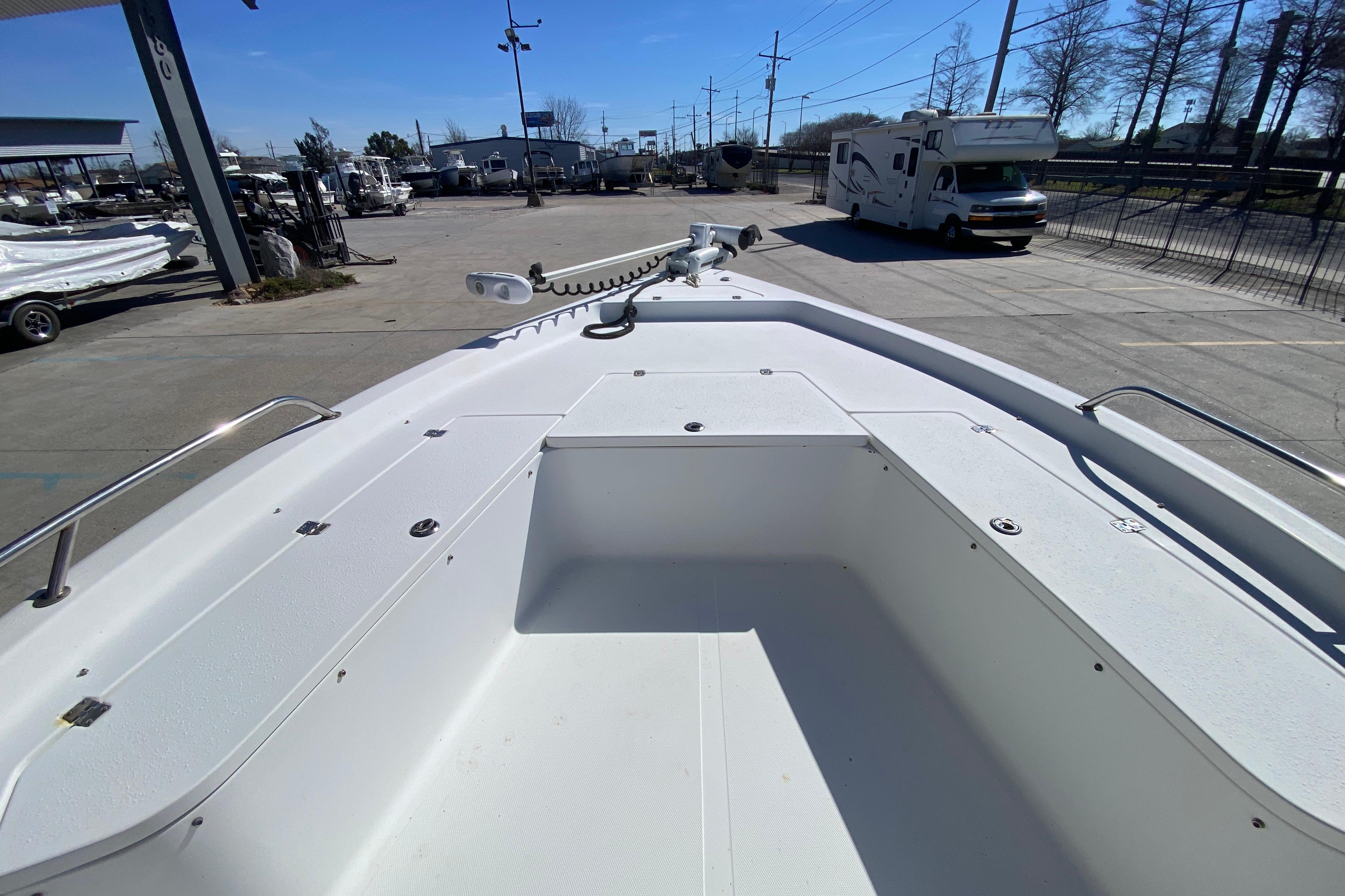 2005 Sea Pro SV2400CC Bay Boat deck view in a marina setting.