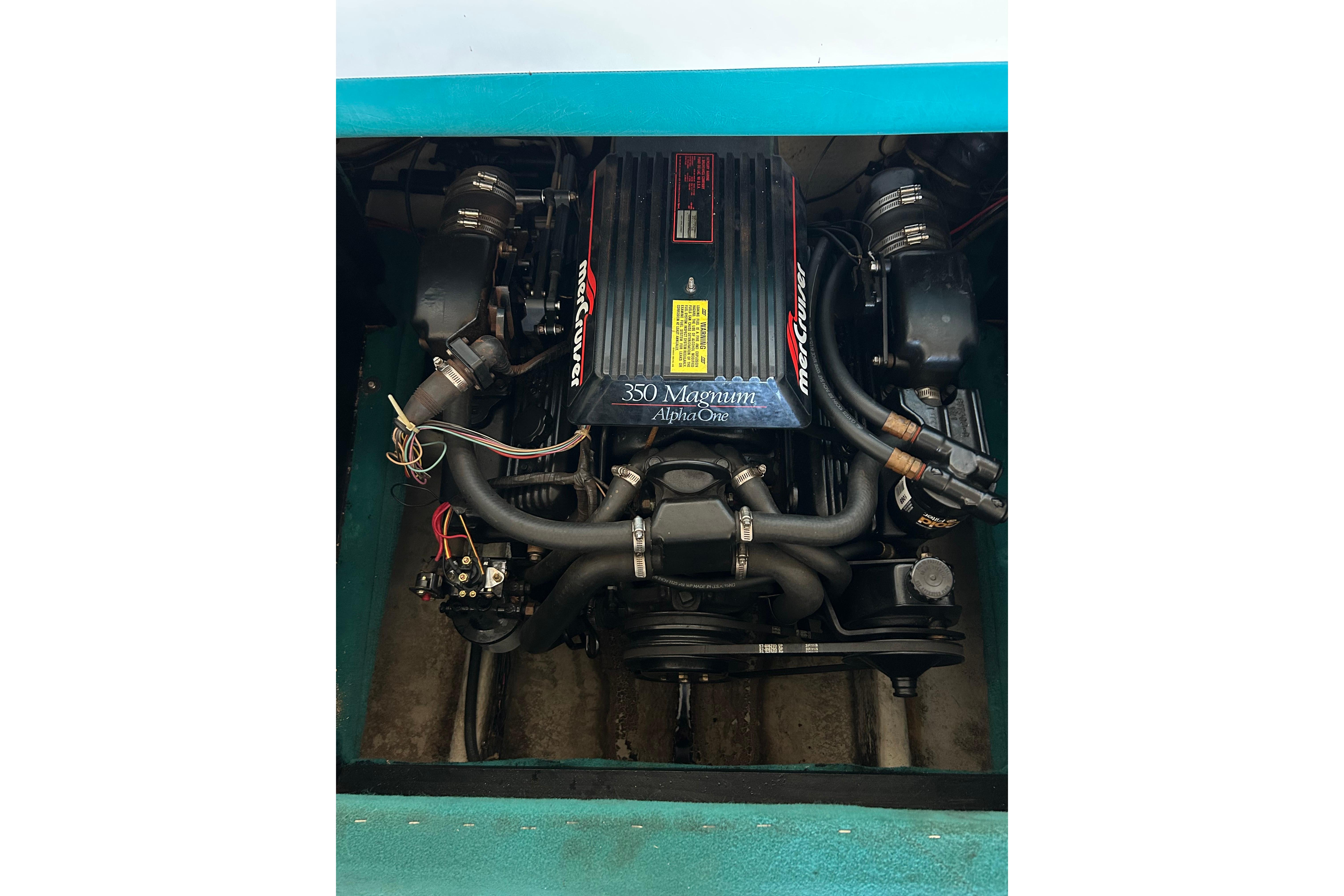 Engine of 1991 Wellcraft 232 Eclipse boat, featuring MerCruiser 350 Magnum Alpha One.