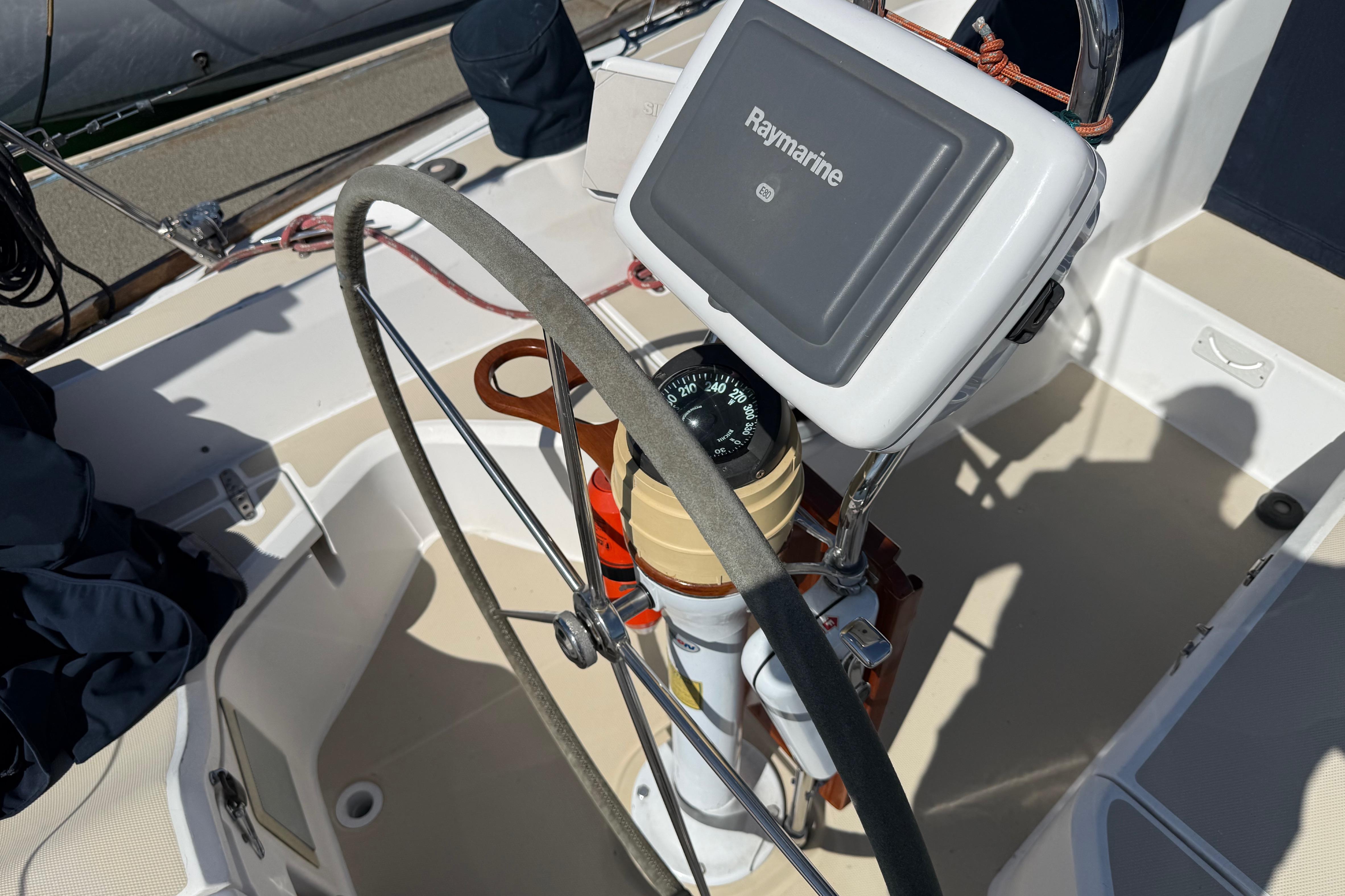 Steering wheel and navigation equipment on a 2004 Sabre 386 sailboat.