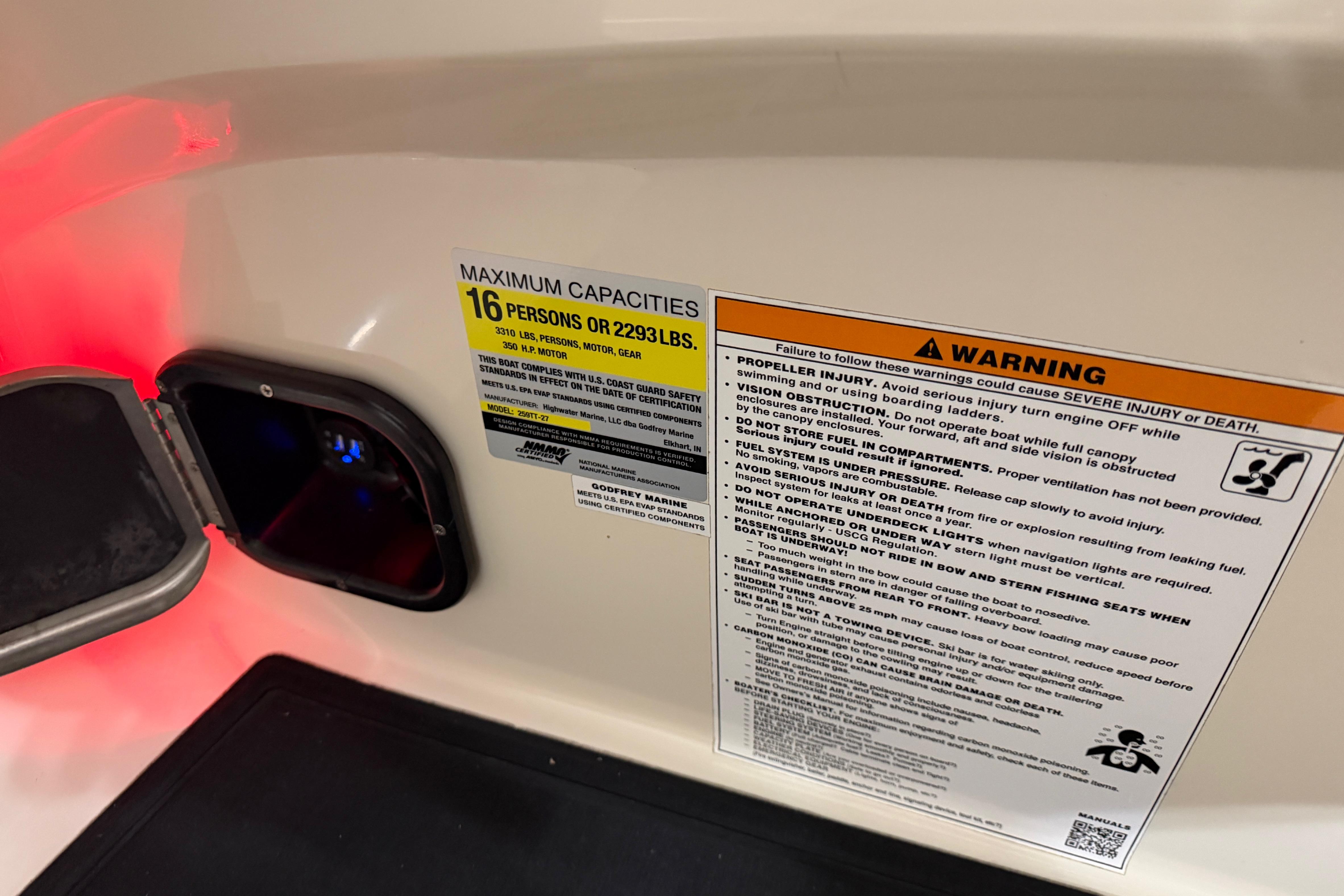 Safety and capacity labels on a 2018 Godfrey Sanpan 2500 ULC boat.