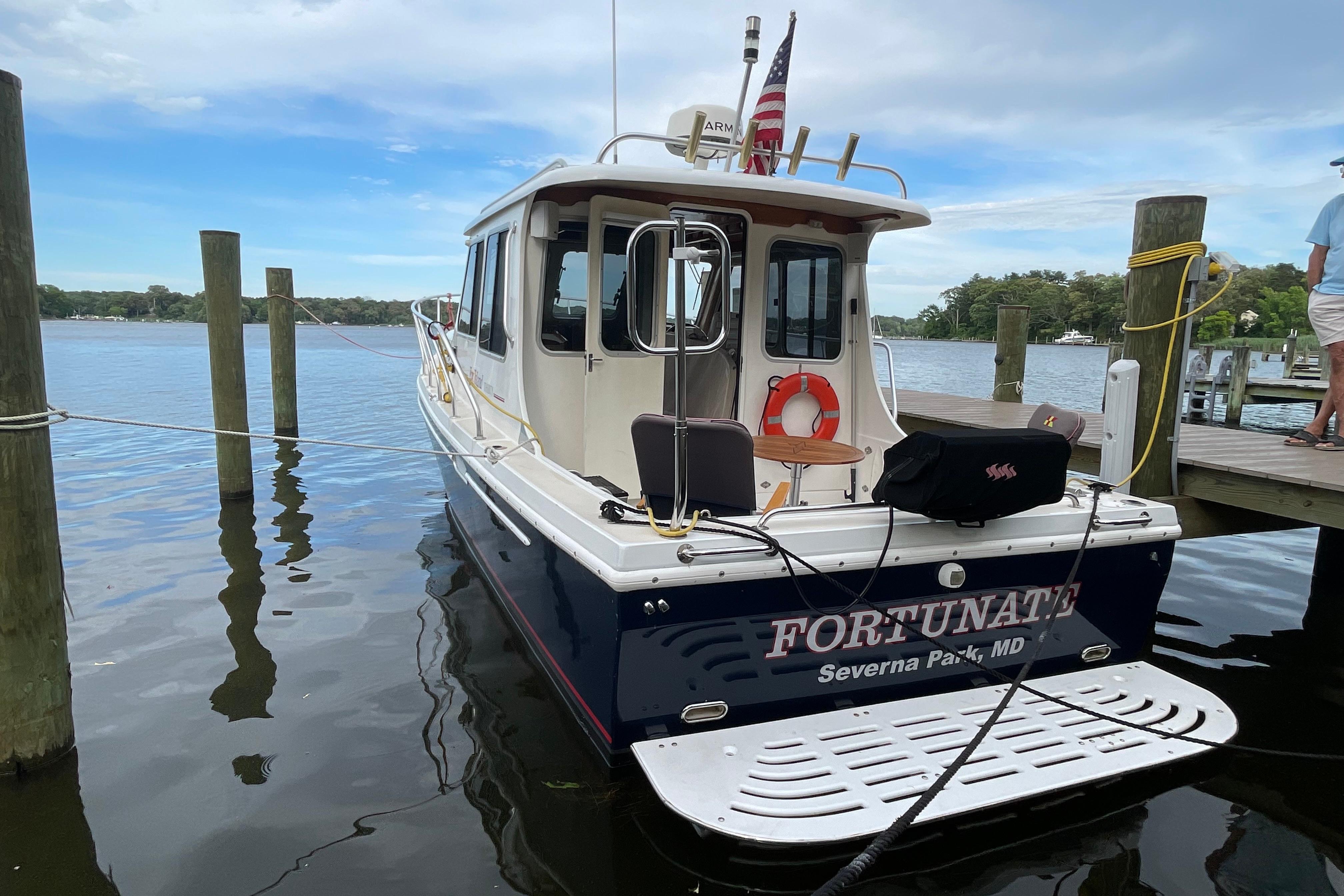 2005 Fox Island Thirty Sedan Cruiser docked, displaying "Fortunate" and Severna Park, MD.