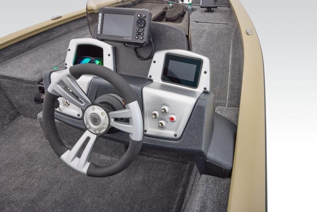 2026 Tracker Pro Team 175 boat dashboard with steering wheel and electronic displays.