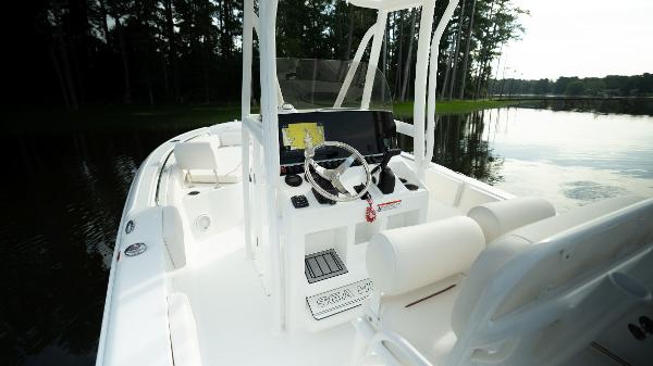 2024 Sea Hunt Ultra 234 boat interior with steering console and seating.