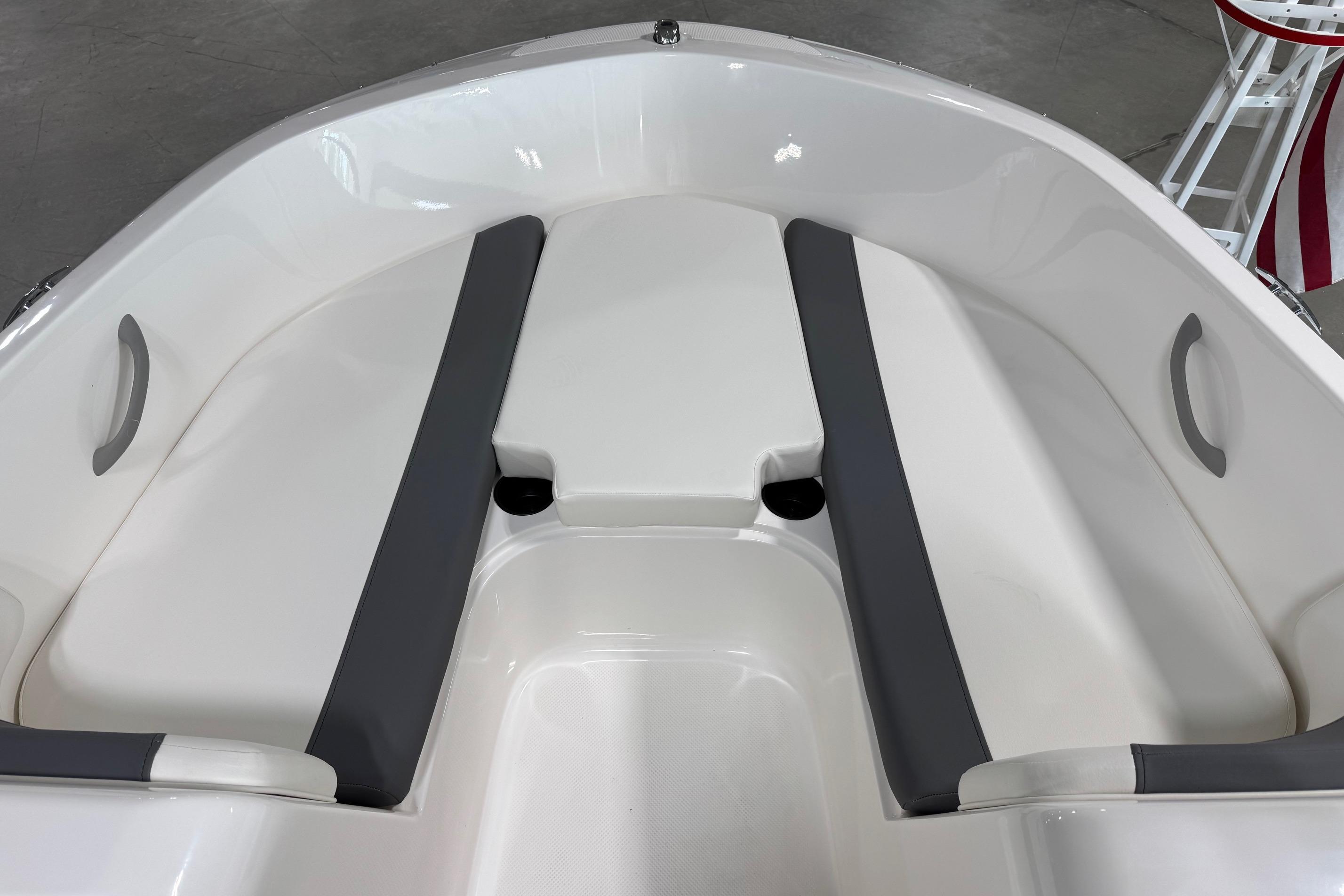 2026 Bayliner Element E18 boat interior with gray seating and white hull.