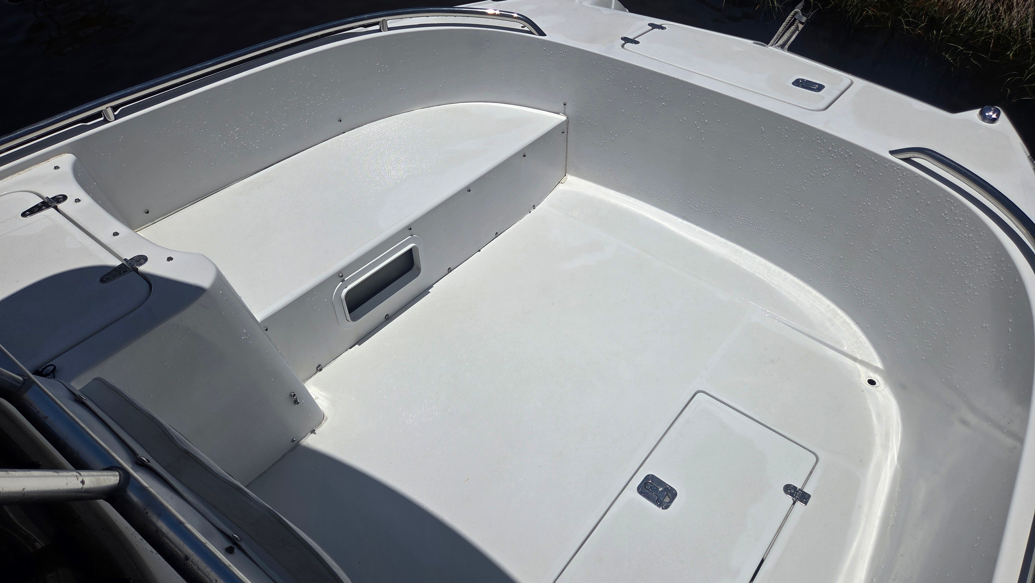 The image shows the spacious, open deck of a Glacier Bay Canyon Runner 2260 boat.