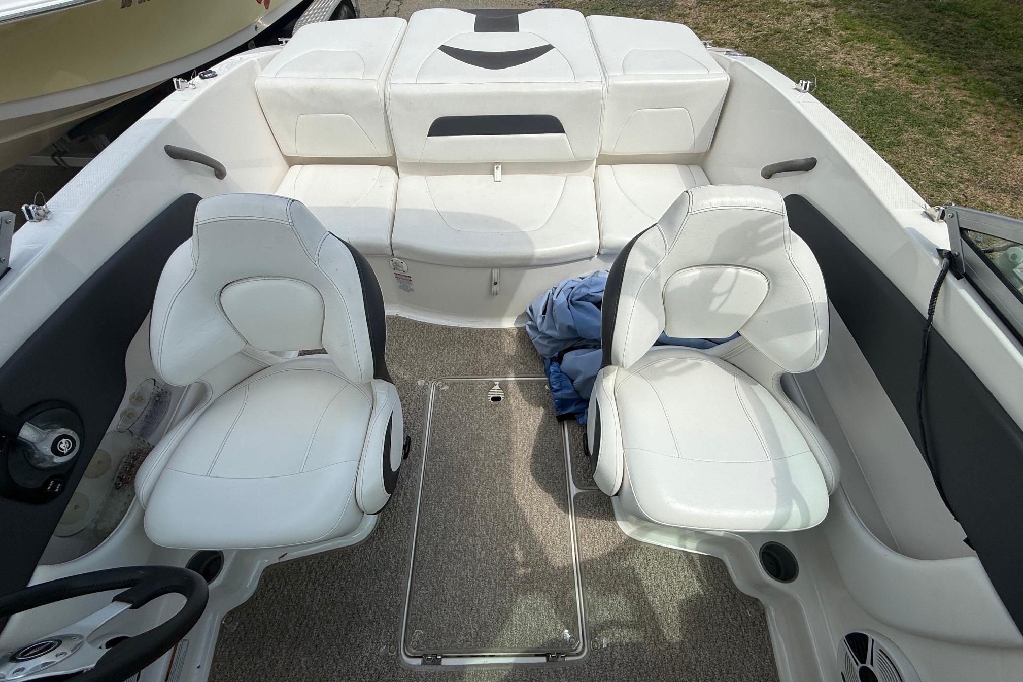 Interior of a 2012 Chaparral 18 H2O Sport boat with white seating.