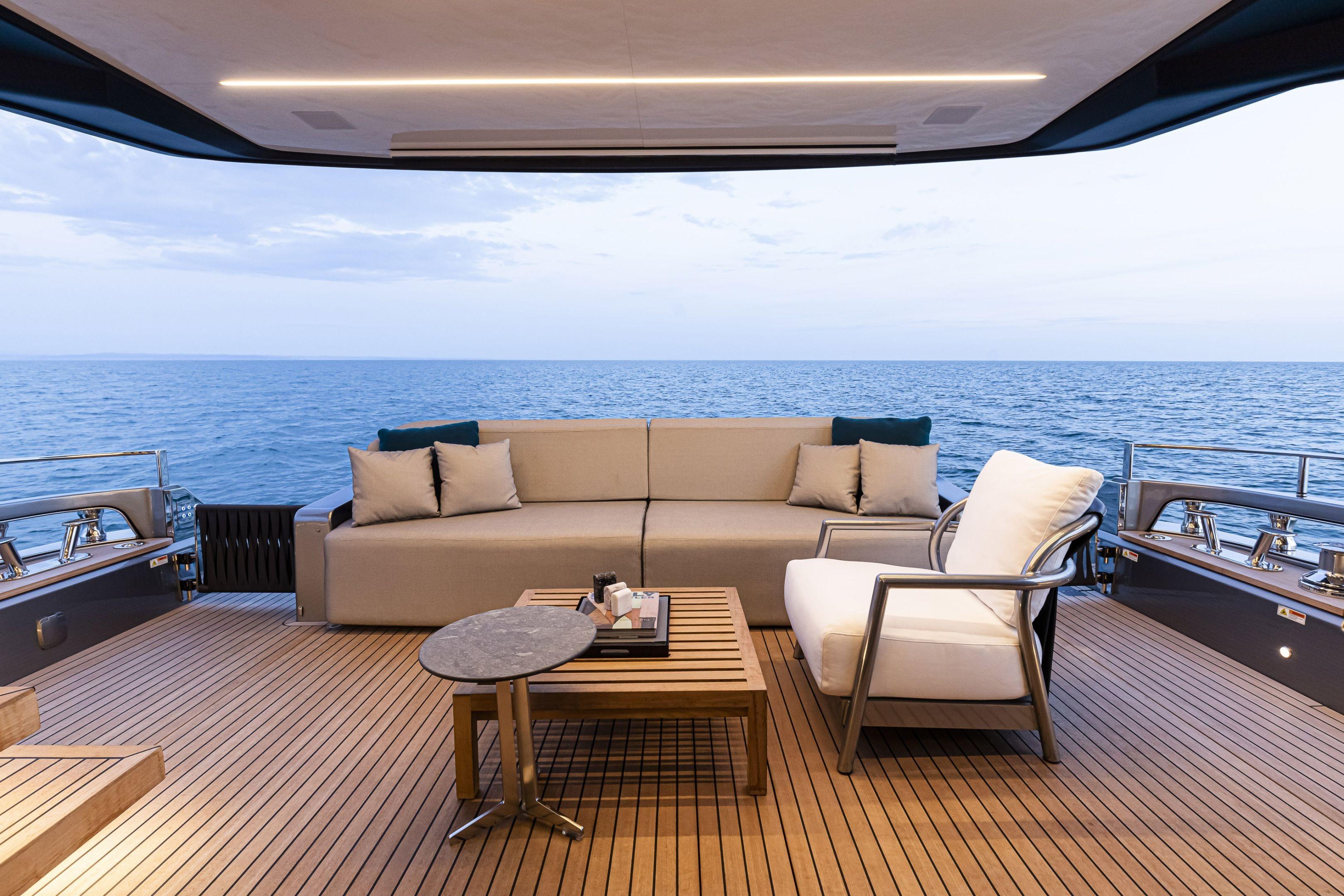Luxurious 2026 Cranchi Sessantasette 67 yacht deck with elegant seating and ocean view.