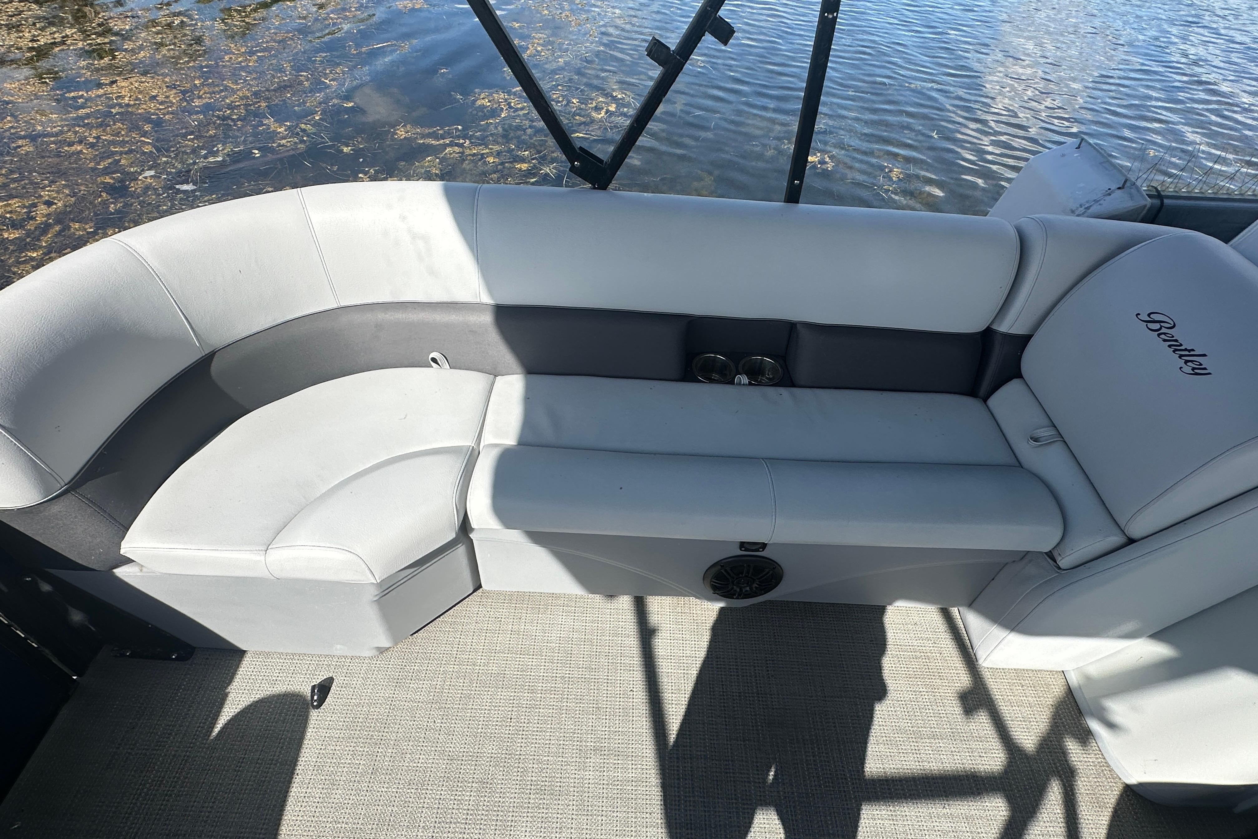 2023 Bentley Pontoons Legacy 243 Swingback interior seating with water view.