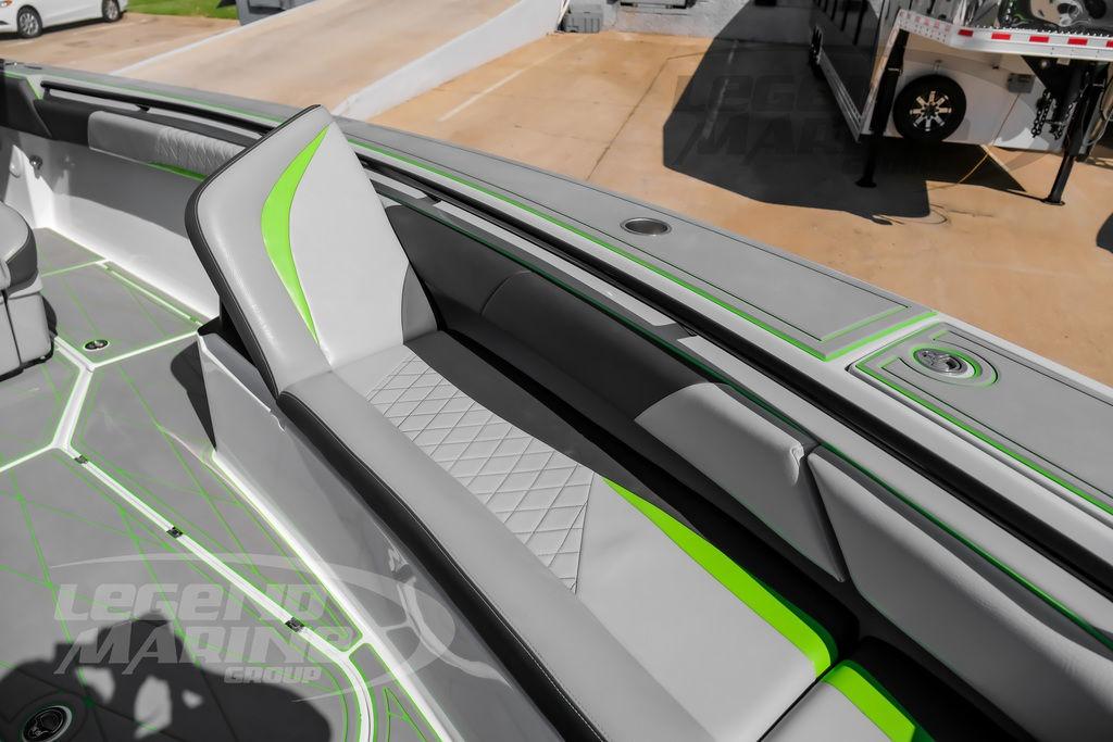 2024 Statement 350 Open boat interior with sleek gray and green seating design.