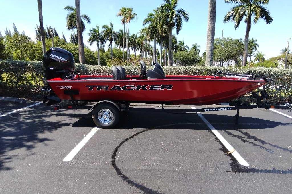 2026 Tracker Pro Team 175 Crappie Edition boat in parking lot with palm trees.