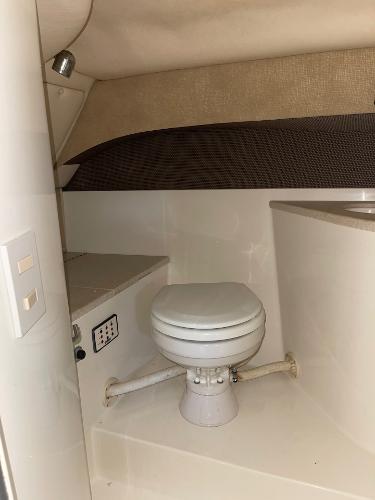 2005 Cobalt 343 boat interior with compact marine toilet.