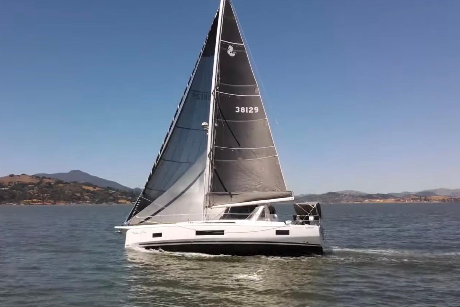 2020 Beneteau Oceanis 46.1 sailing on a calm sea under clear blue skies.