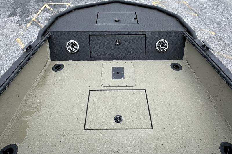 2026 SeaArk Predator 300 AK boat deck with storage compartments and speakers.