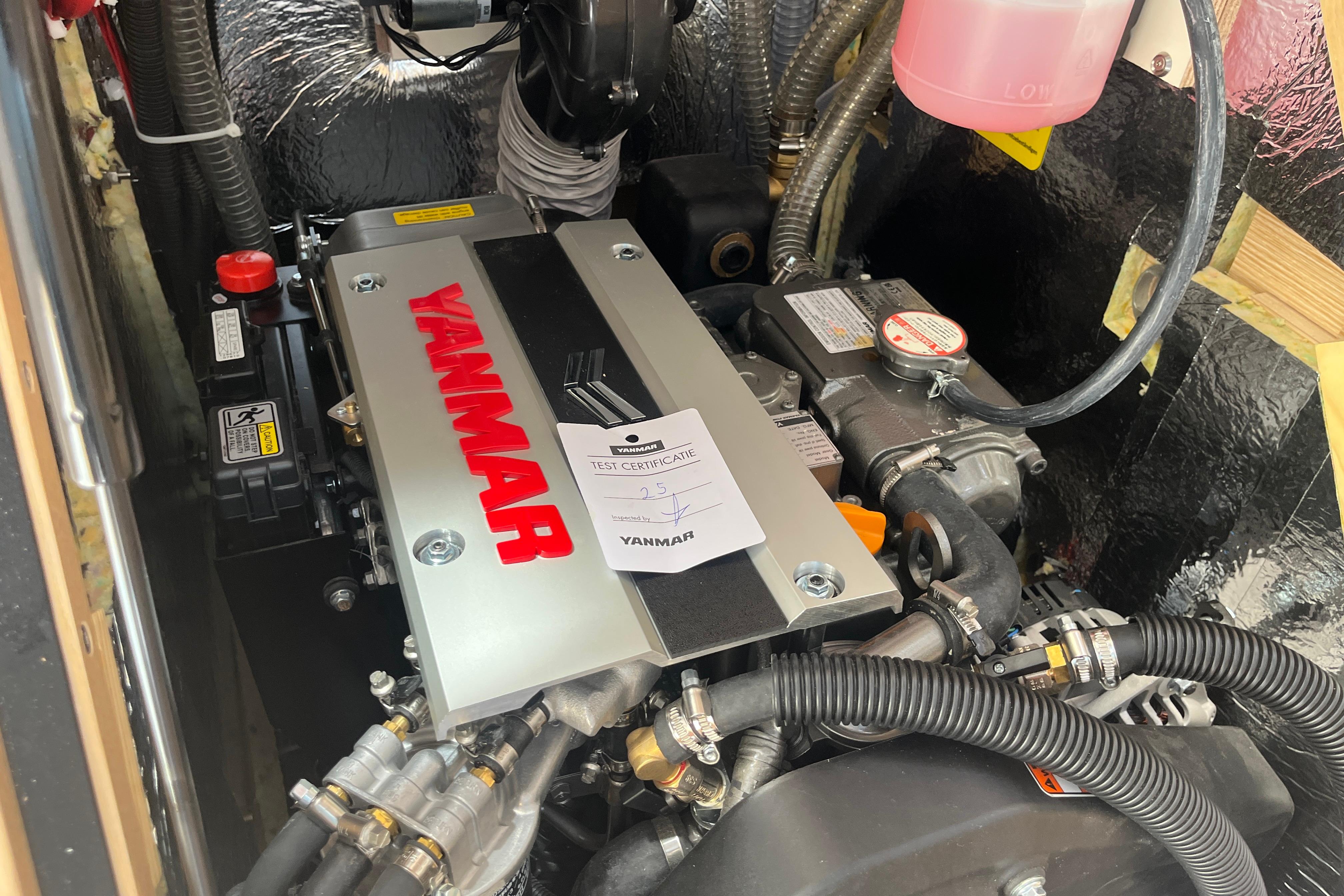 Engine compartment of a 2025 Hanse 360 yacht featuring a Yanmar engine.