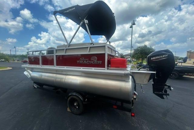 2026 Sun Tracker Bass Buggy 16 XL Select pontoon boat with Mercury outboard motor.