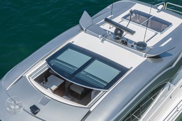 Top view of 2025 Riviera 645 SUV luxury yacht with sunroof and sleek design.