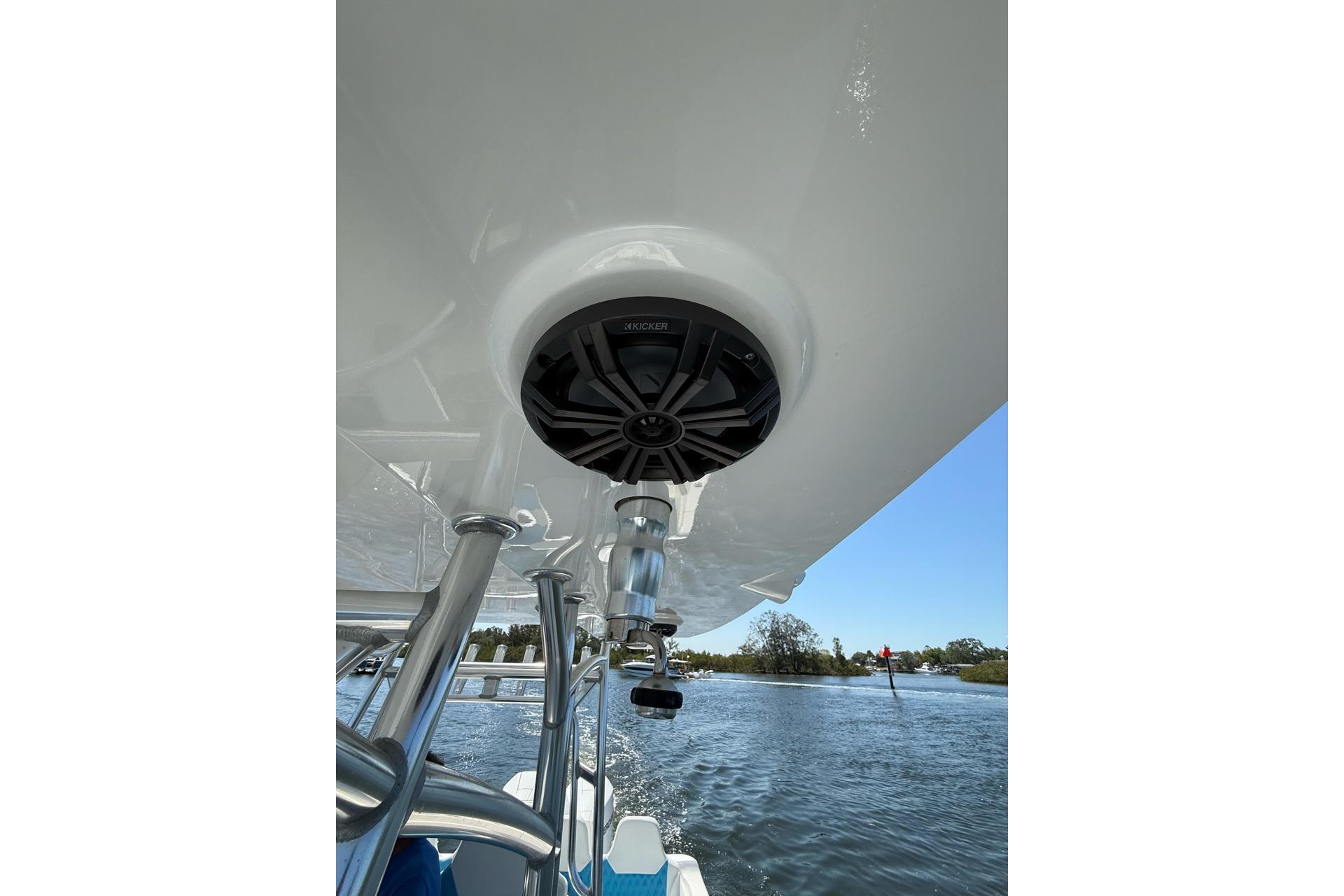 Custom Infusion 34 CC 2021 boat with speaker system, cruising on a sunny day.
