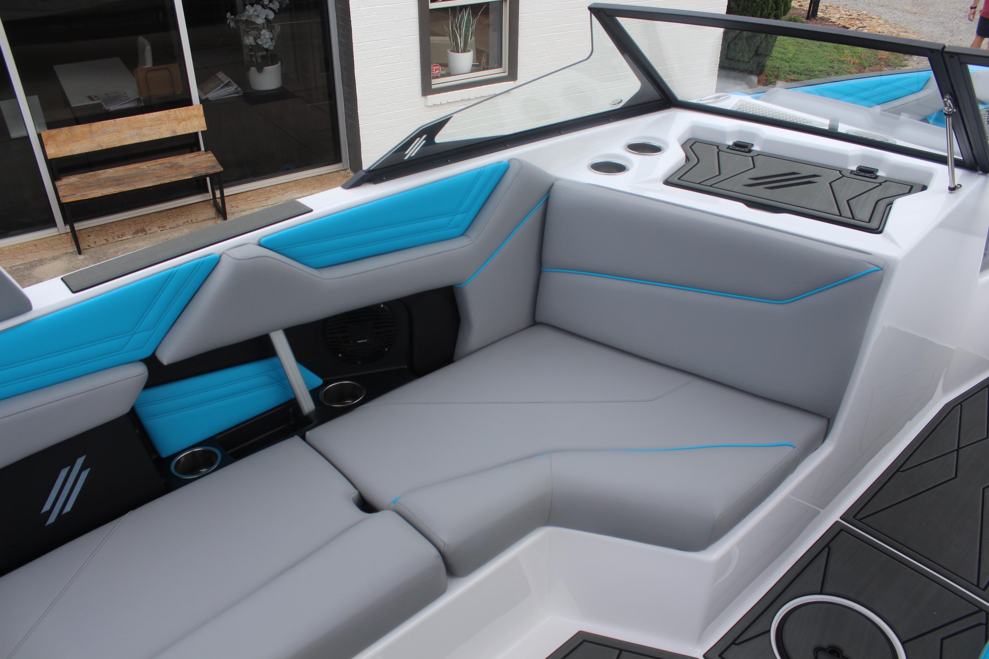 2026 ATX Surf Boats 22 Type-S interior with gray and blue seating, cup holders, and sleek design.