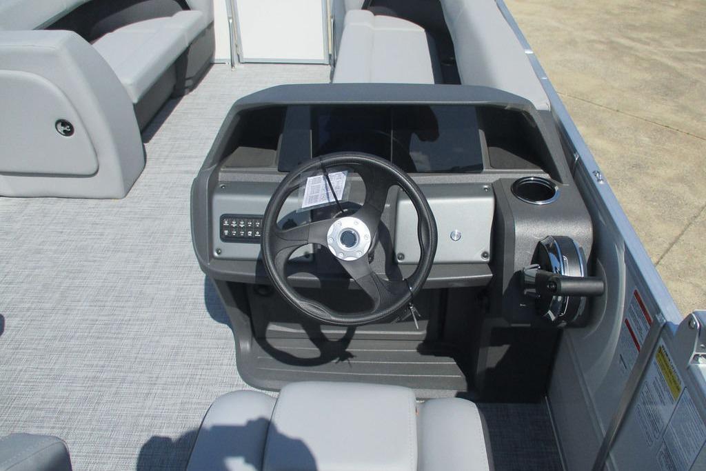 Steering console of 2026 Sun Tracker Party Barge 18 DLX pontoon boat.