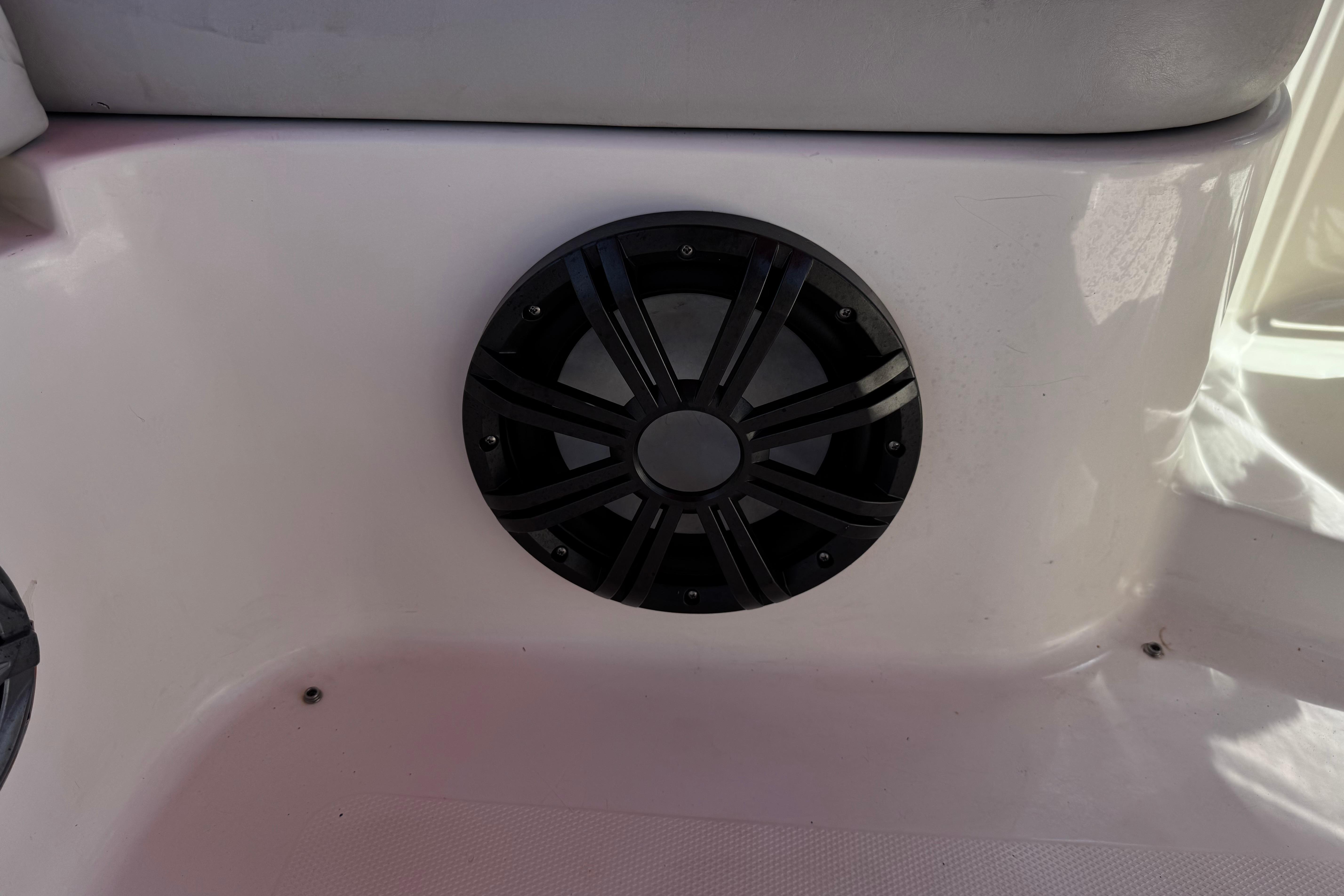 Boat speaker on a 2010 Bryant 255, mounted on white interior panel.
