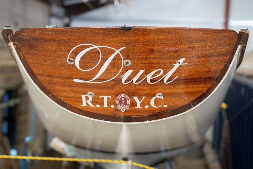 1926 McGruer Alfred Mylne Glen-Coats Gaff Sloop "Duet" with R.T.Y.C. emblem on wooden stern.