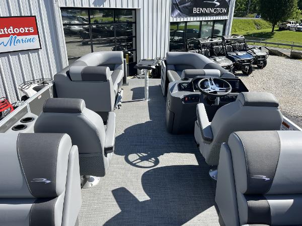 2024 Bennington 22 SVSR pontoon boat interior with gray seating and steering console.