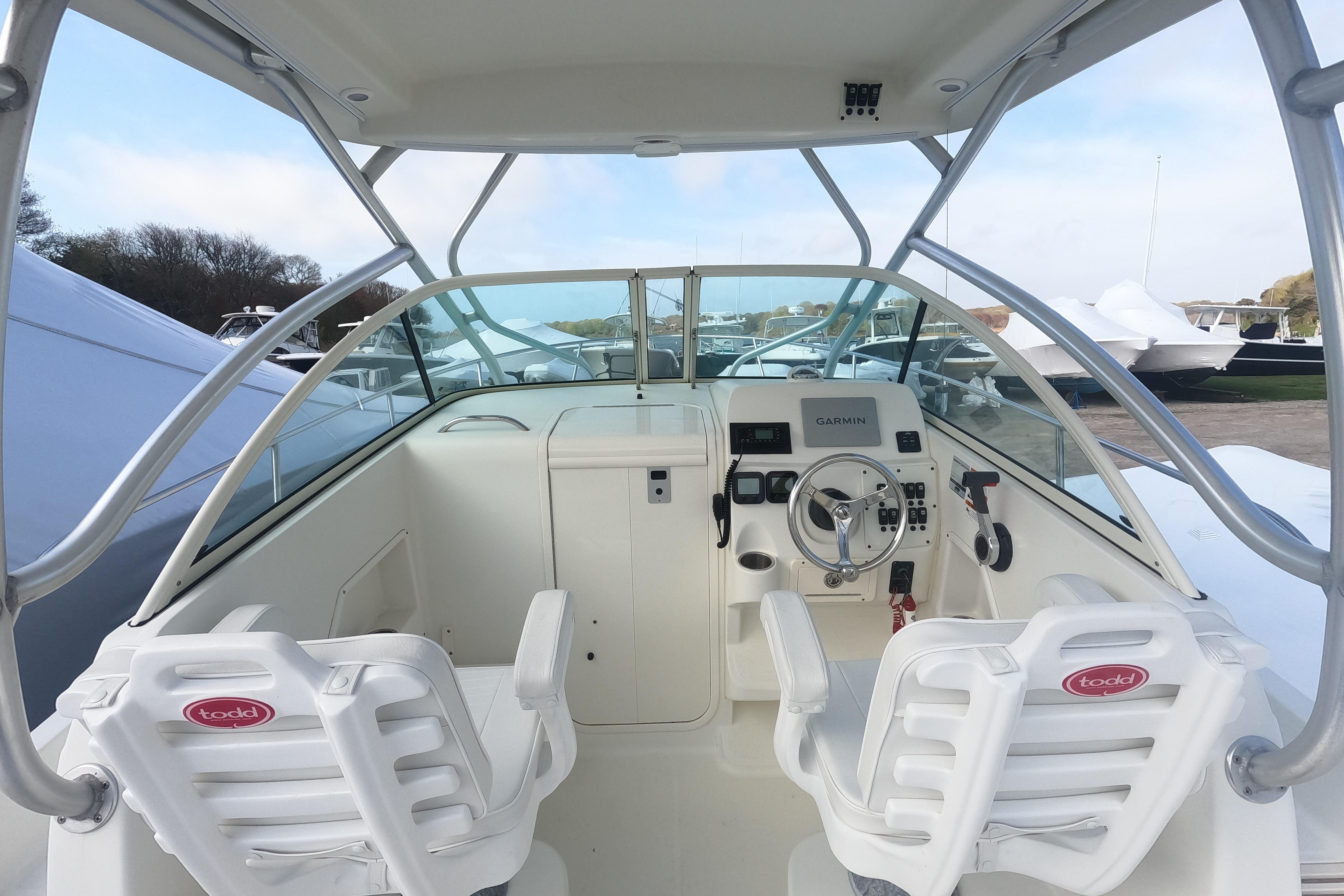 2009 Hydra-Sports 2000 WA boat cockpit with steering wheel and dual seats.
