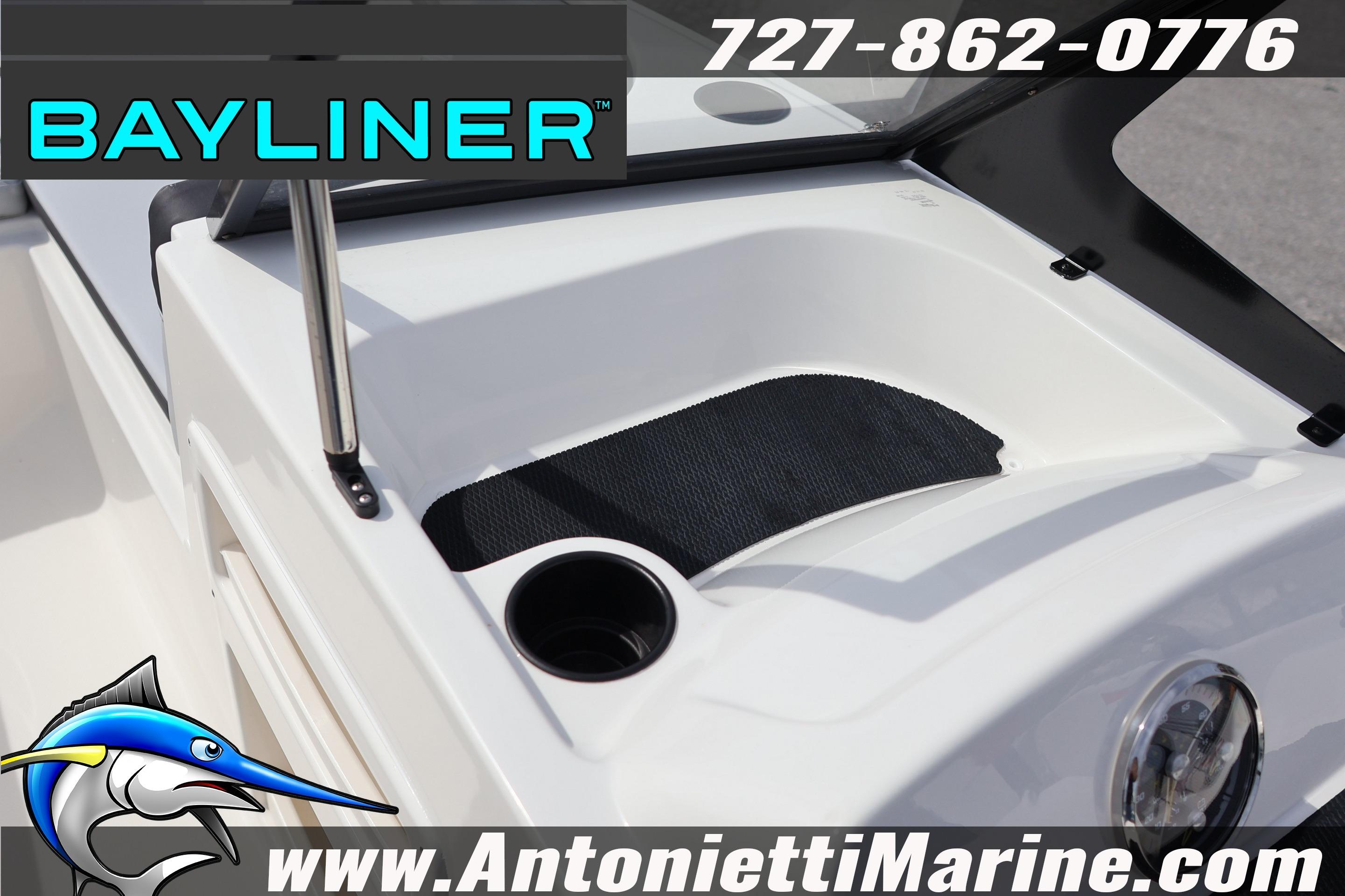 2026 Bayliner Element M17 boat dashboard with cup holder and storage area.